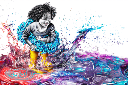 A little girl in a tutu jumps into a colorful puddle