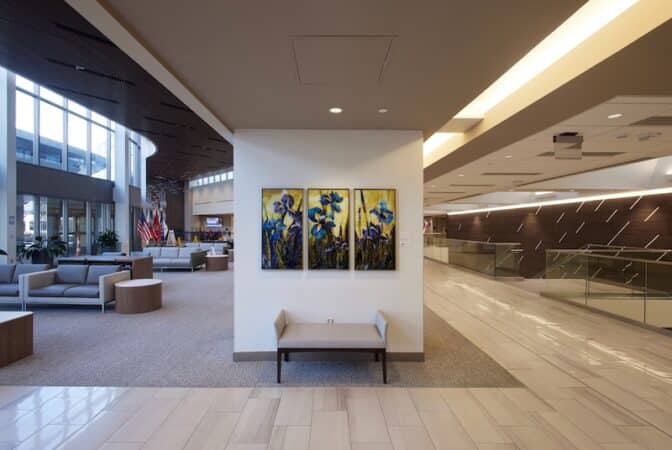 Terri Albanese’s triptych of iris flowers in the Mount Carmel Hospital lobby