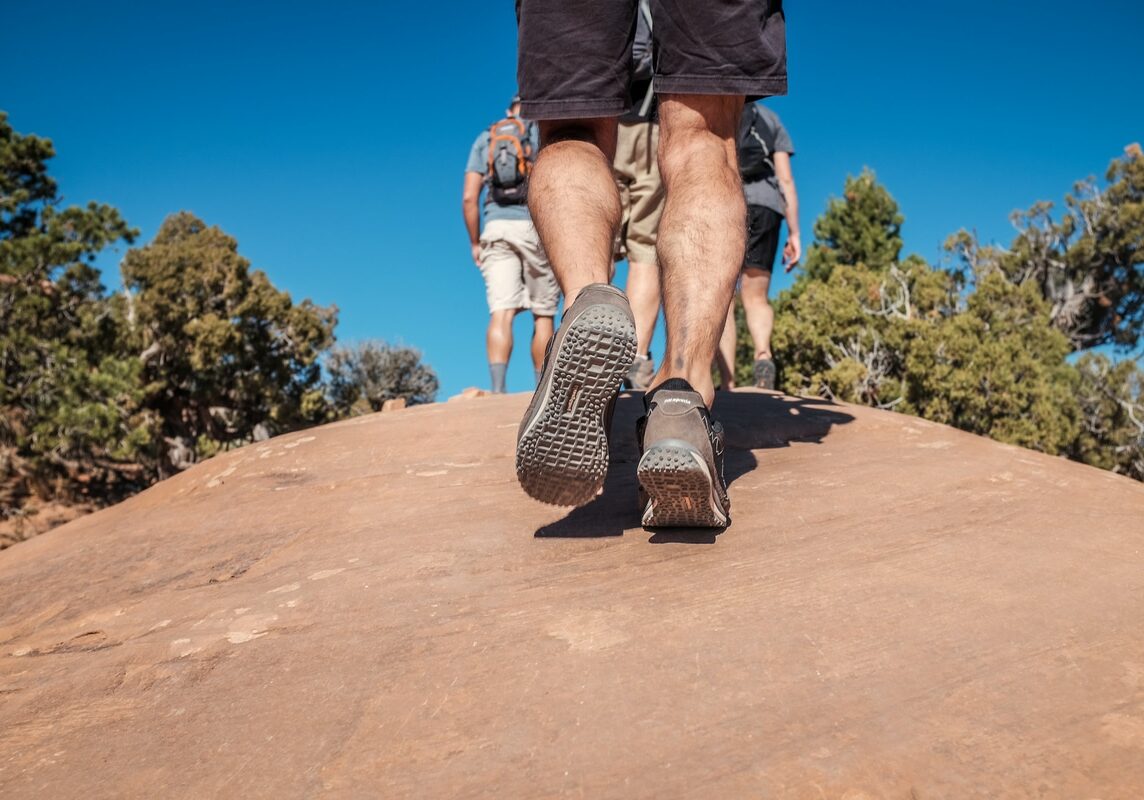 Closeup of feet climbing hill-stockshot