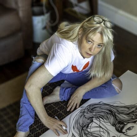 Illustrator Melissa Whitaker drawing John Lennon