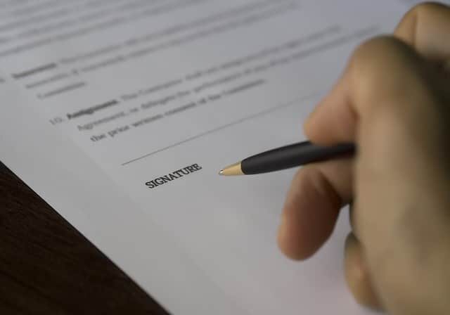 stock image of contract being signed